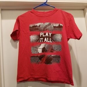 Dynasty red short sleeve play it all sports shirt size medium 10-12